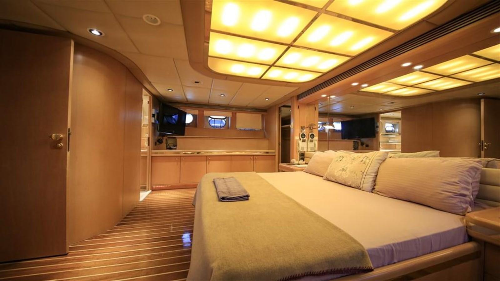 a room with a bed and a laptop on the bed aboard AGARTHA Yacht for Sale