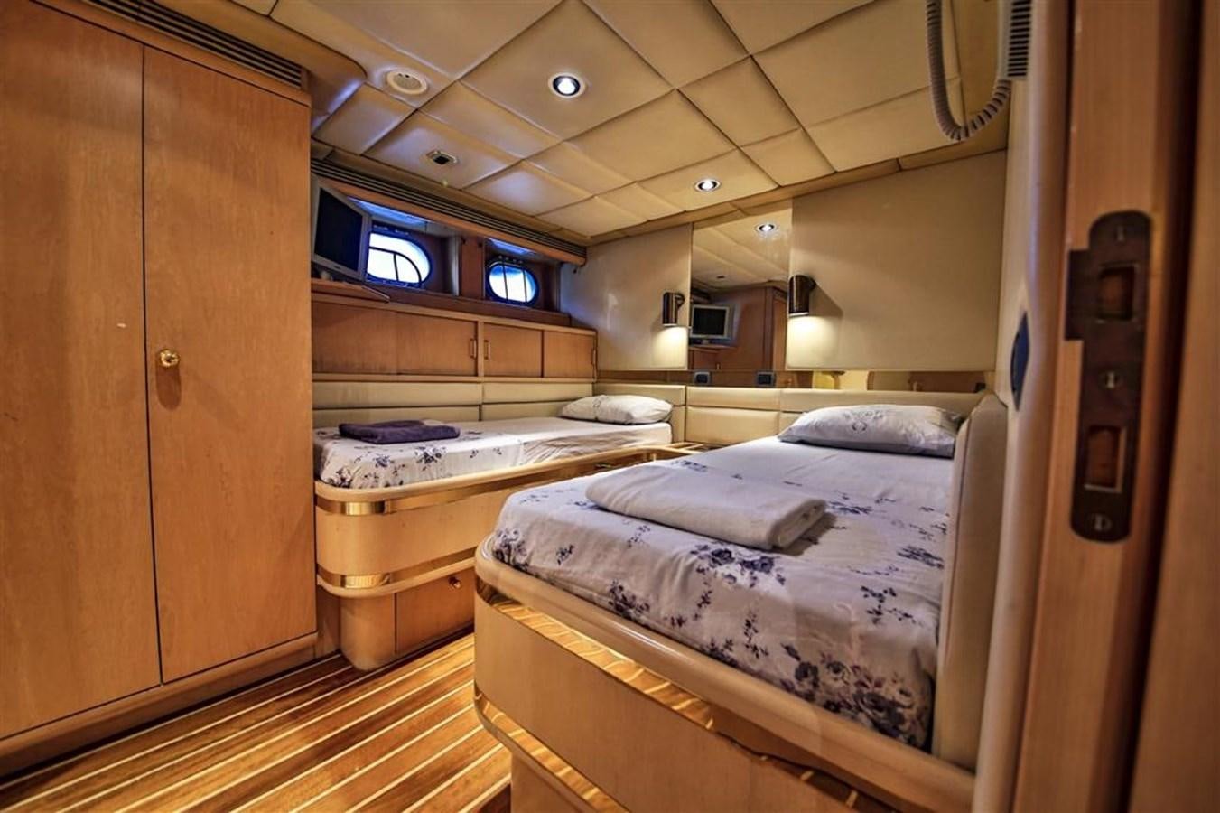 a room with a bed and a closet aboard AGARTHA Yacht for Sale