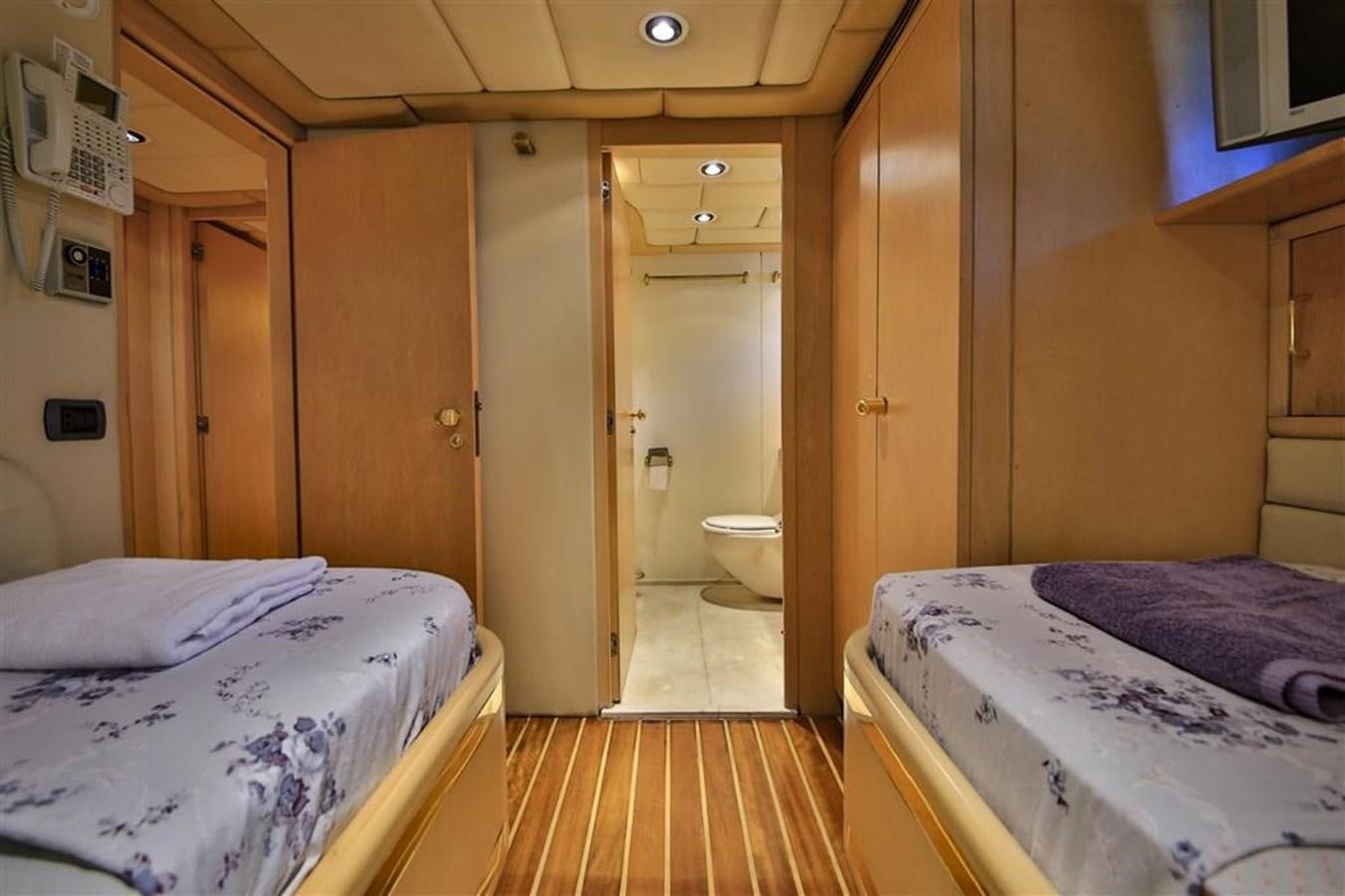 a room with a bed and a door aboard AGARTHA Yacht for Sale