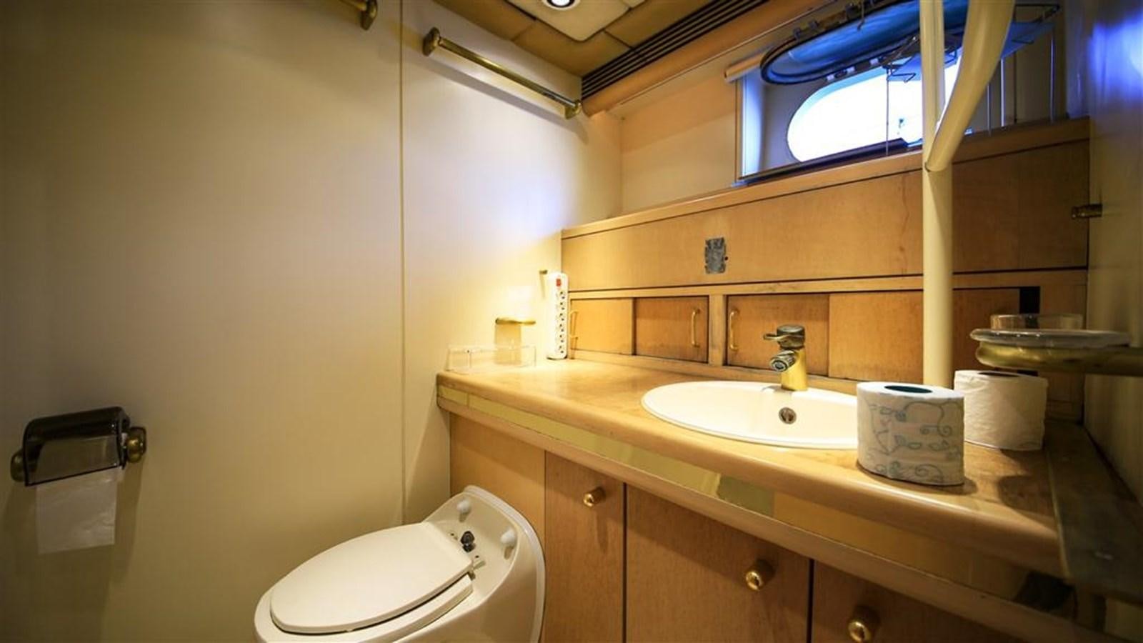 a bathroom with a sink and a toilet aboard AGARTHA Yacht for Sale