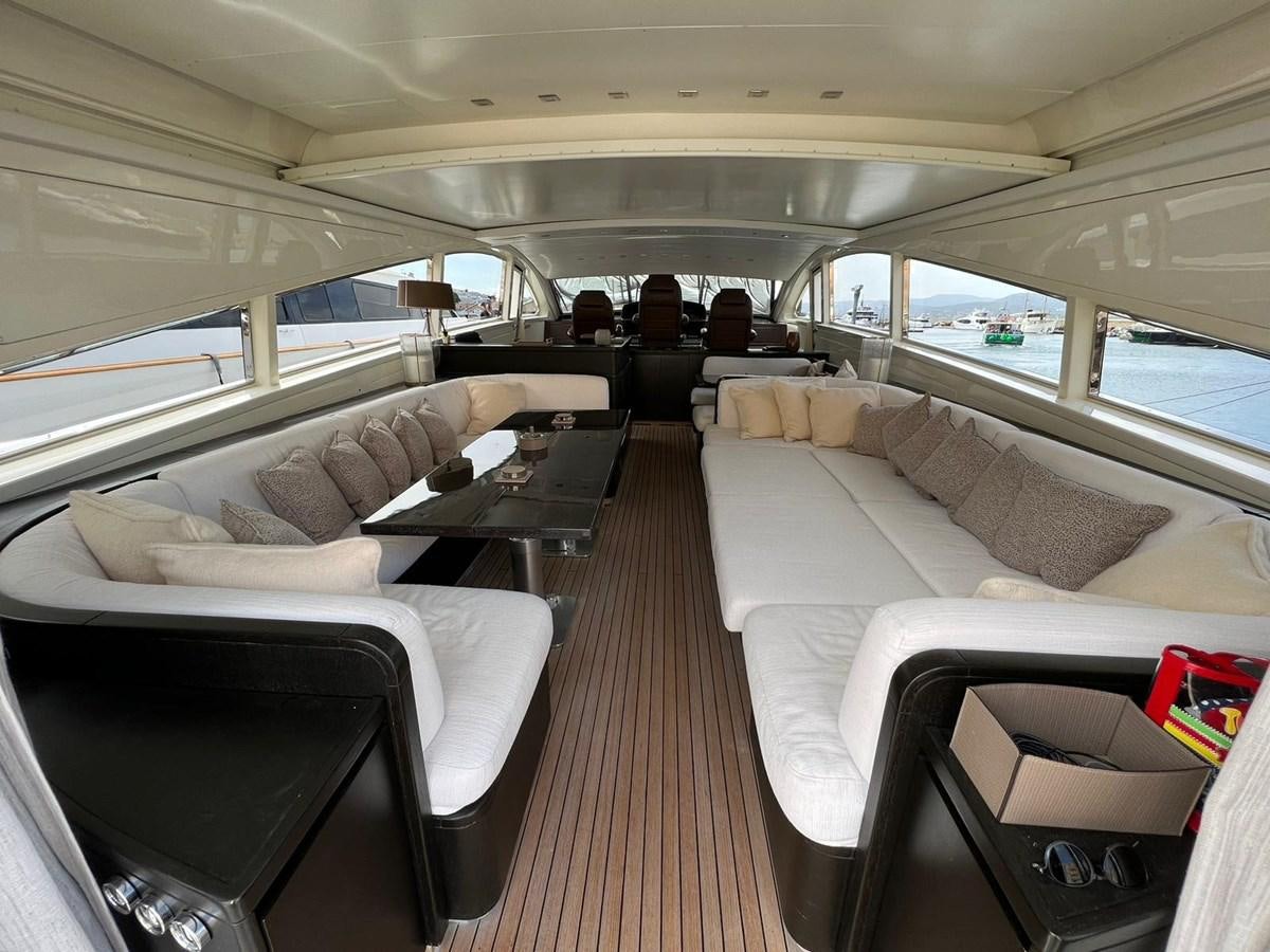a train with a couch and a table aboard SAGA ONE Yacht for Sale