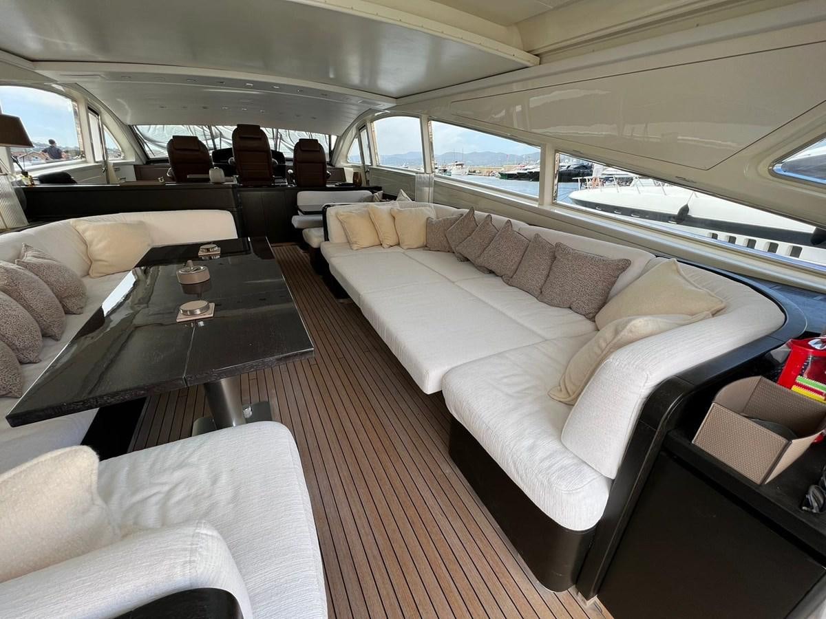 a car with a table and chairs aboard SAGA ONE Yacht for Sale