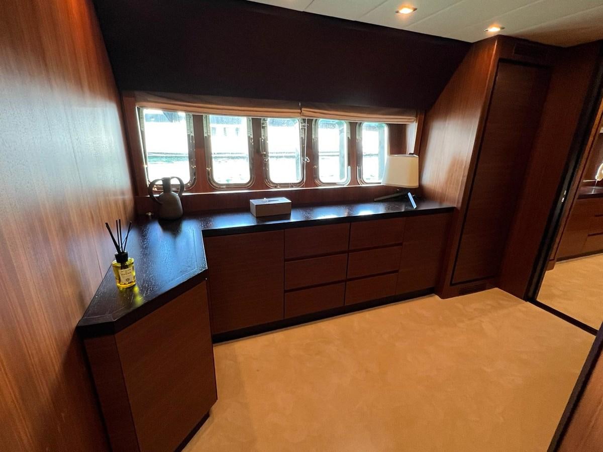 a room with wooden cabinets and a glass window aboard SAGA ONE Yacht for Sale