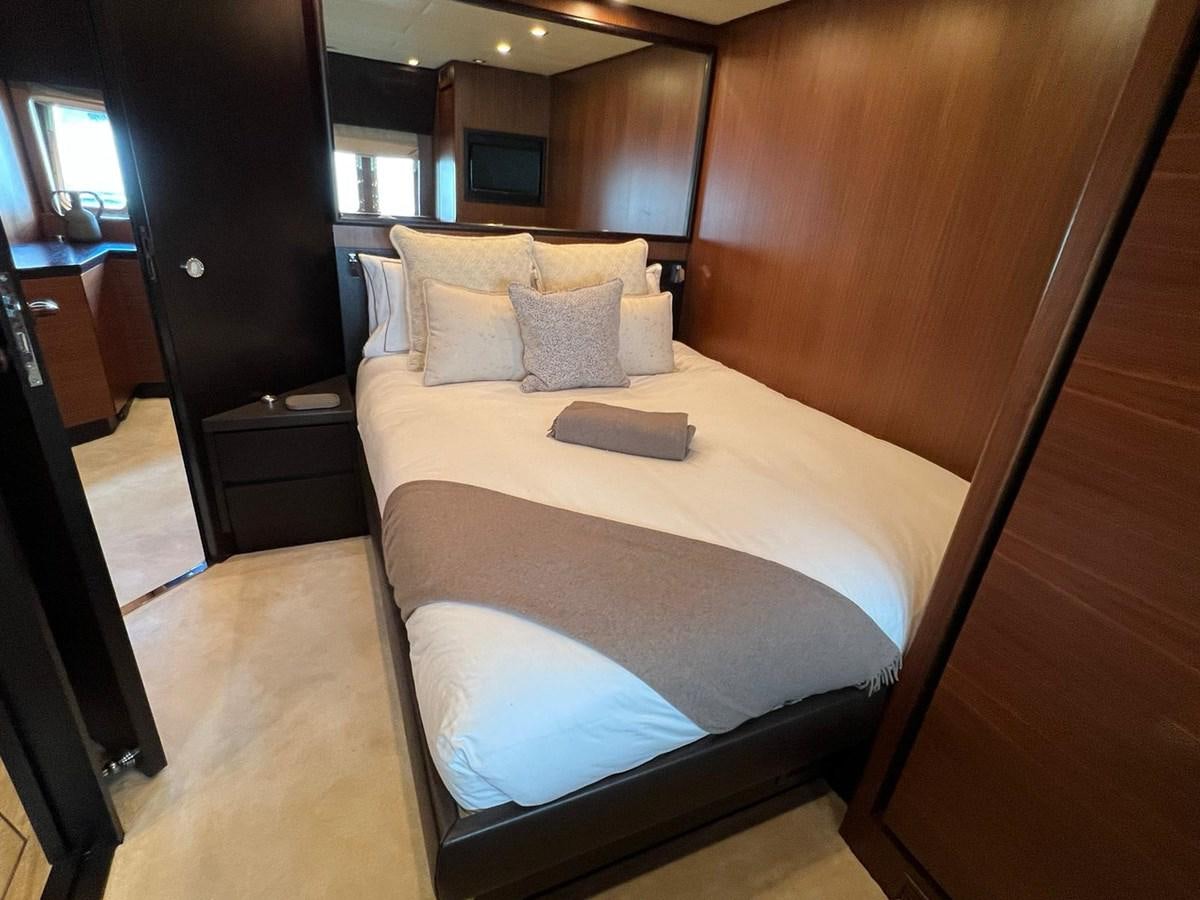 a bed with white sheets aboard SAGA ONE Yacht for Sale