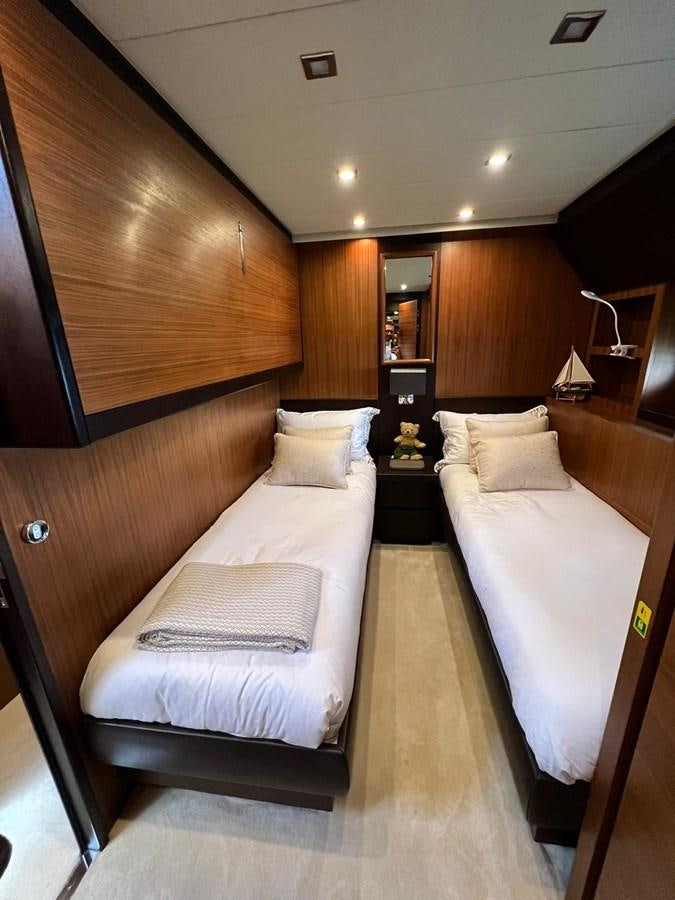 a room with two beds aboard SAGA ONE Yacht for Sale