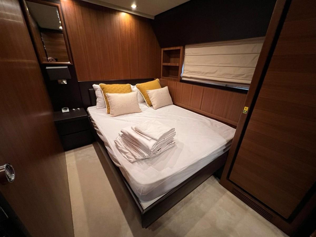 a bed with a white sheet aboard SAGA ONE Yacht for Sale