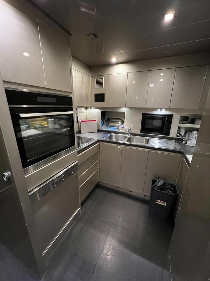 a kitchen with a microwave oven aboard SAGA ONE Yacht for Sale