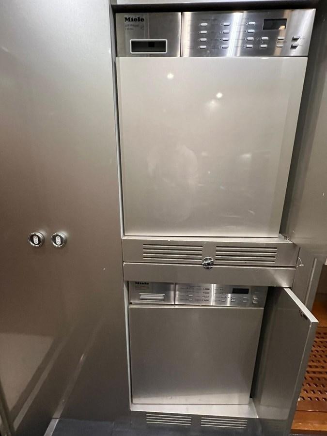 a silver refrigerator in a room aboard SAGA ONE Yacht for Sale