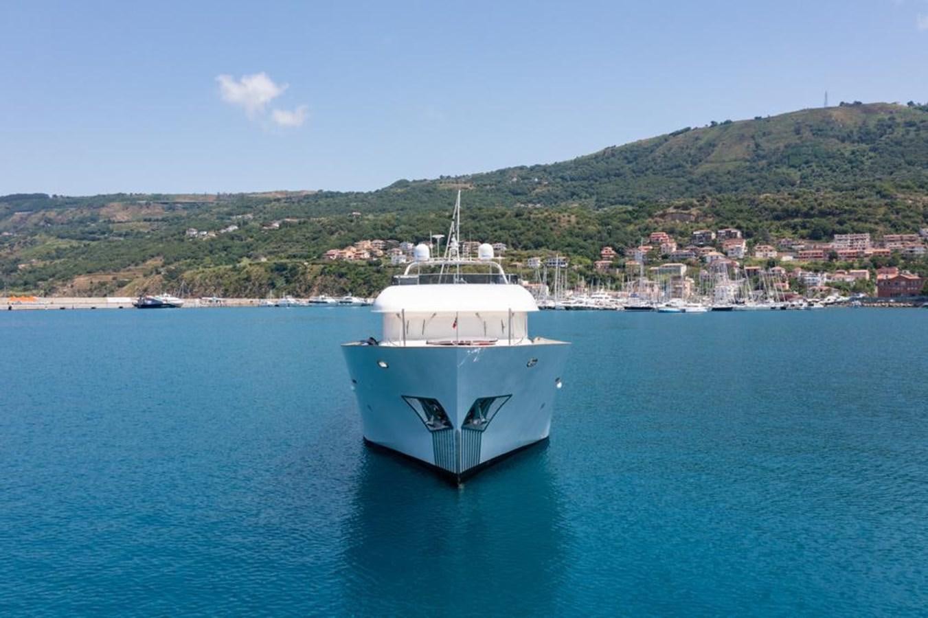 a white boat in the water aboard MR GU Yacht for Sale