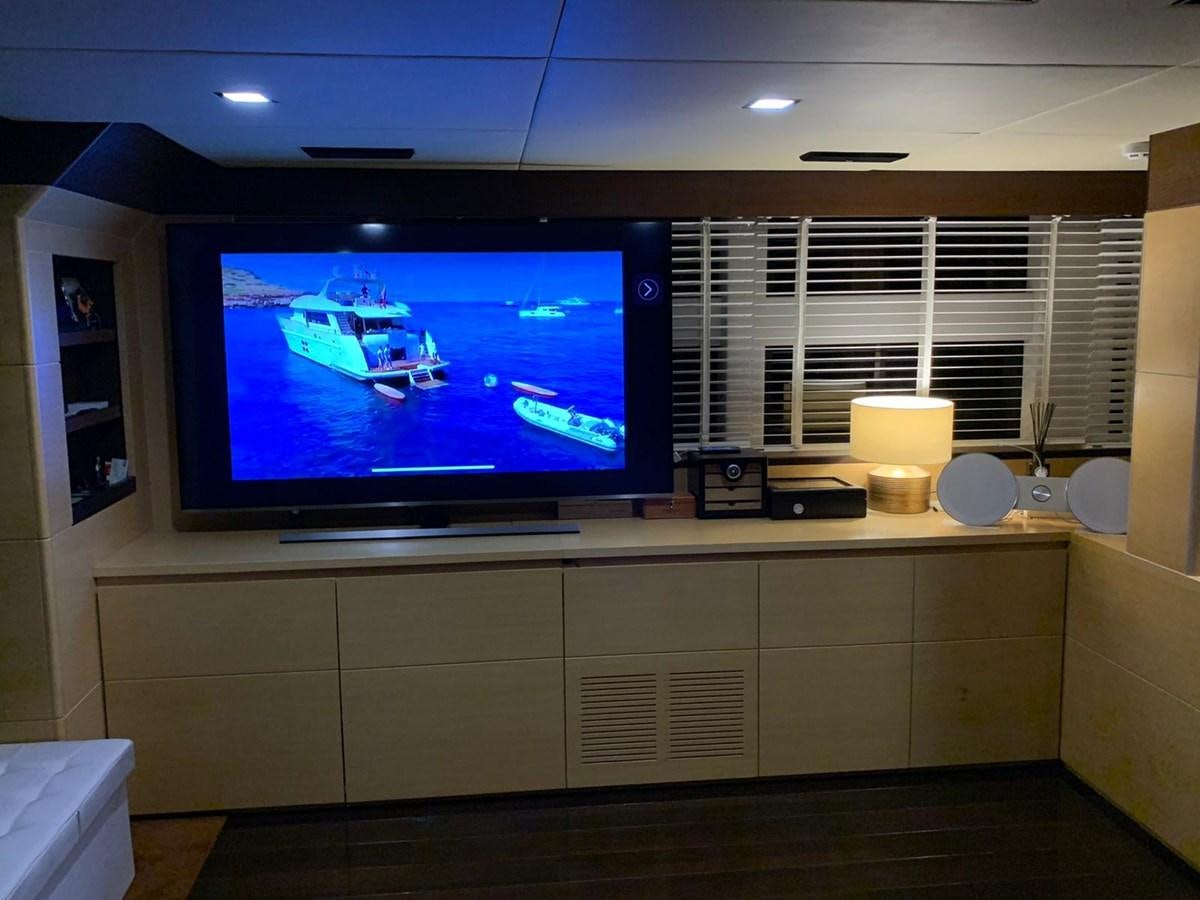 a tv on a counter aboard MR GU Yacht for Sale