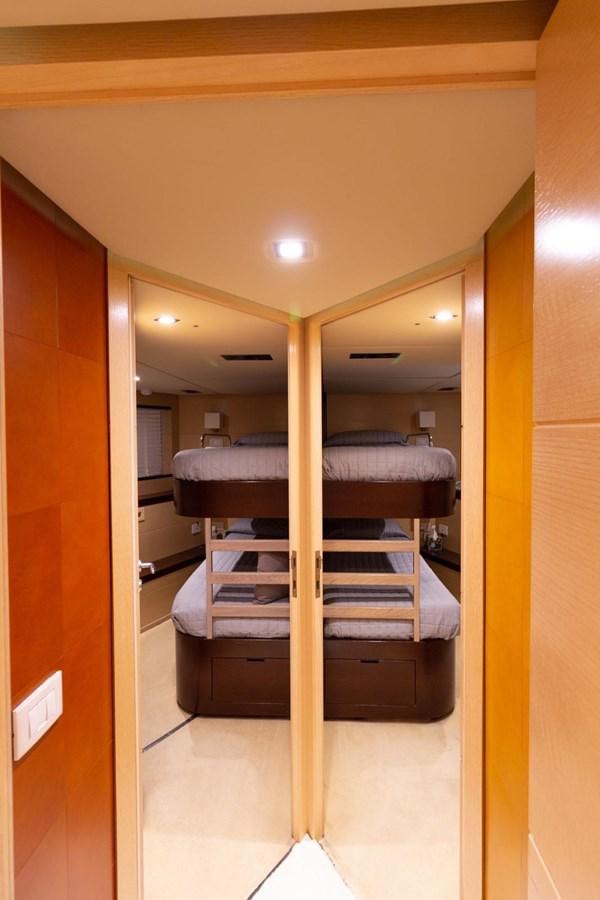 a closet with a bed aboard MR GU Yacht for Sale