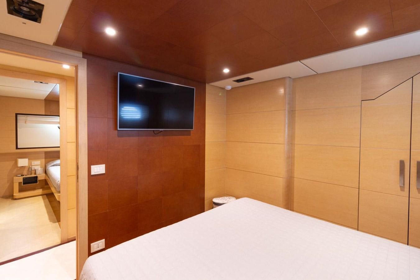 a hotel room with a tv on the wall aboard MR GU Yacht for Sale