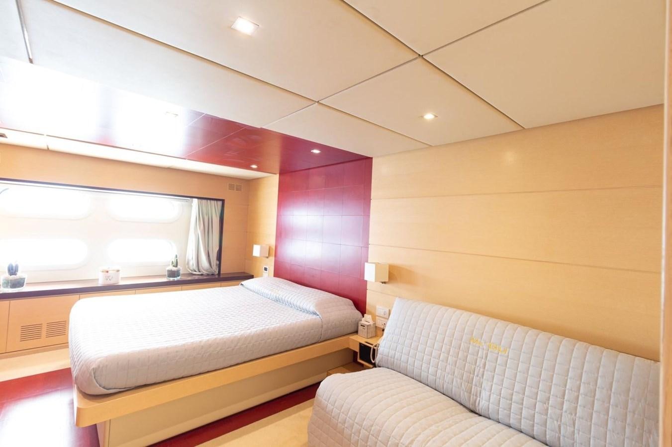 a room with two beds aboard MR GU Yacht for Sale