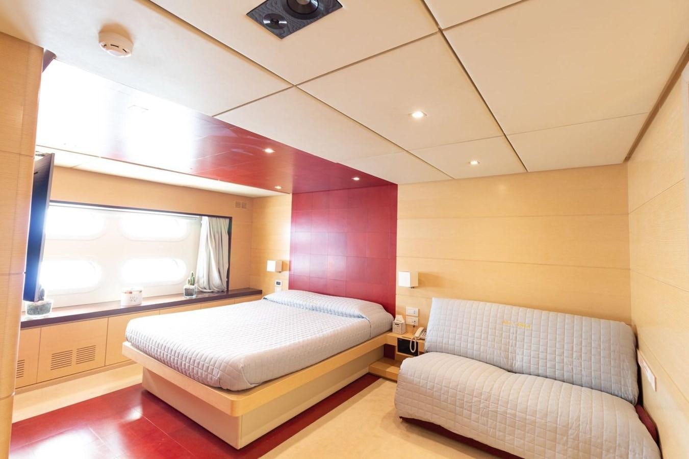 a room with two beds aboard MR GU Yacht for Sale