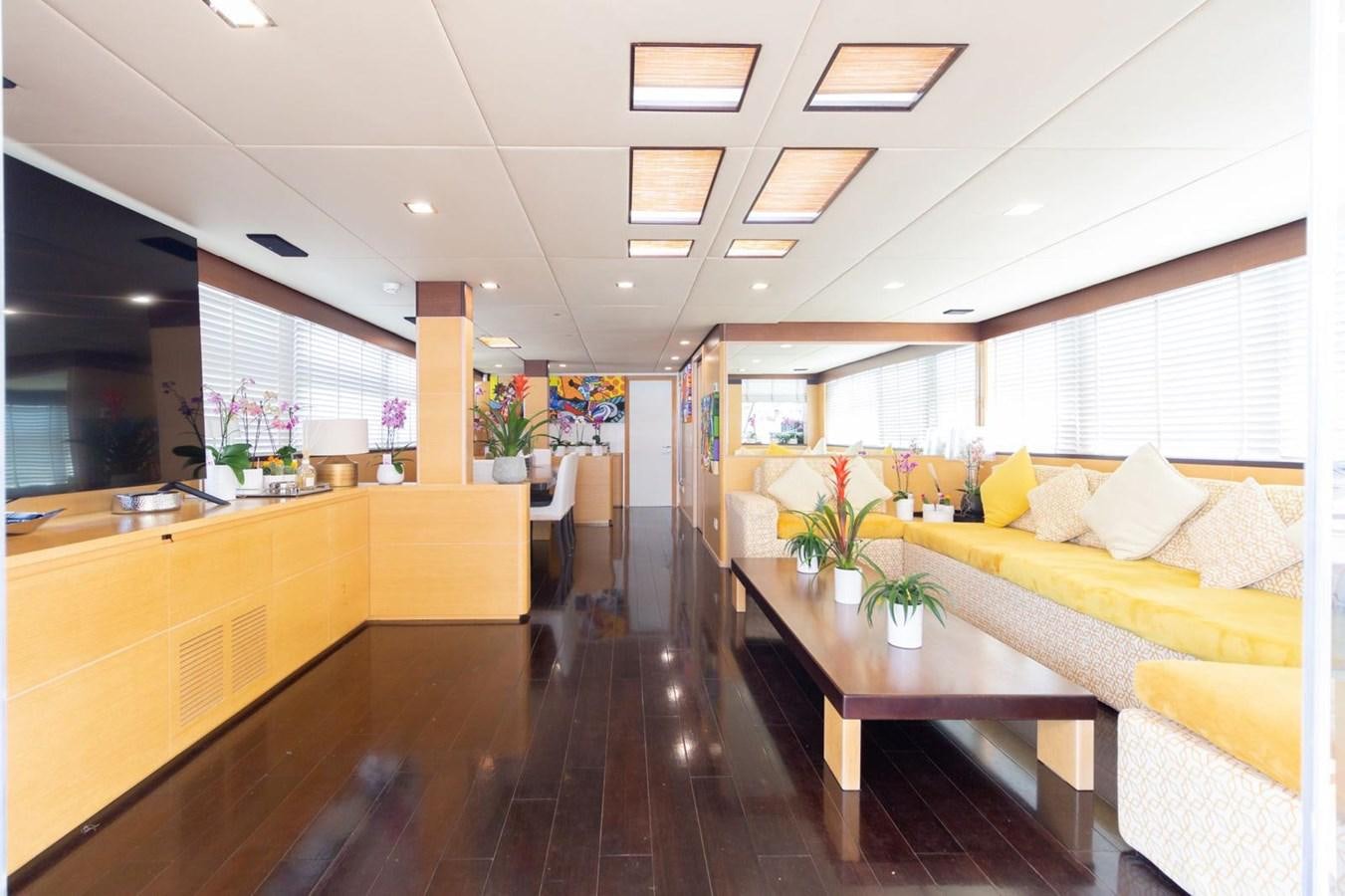 a kitchen and dining area aboard MR GU Yacht for Sale