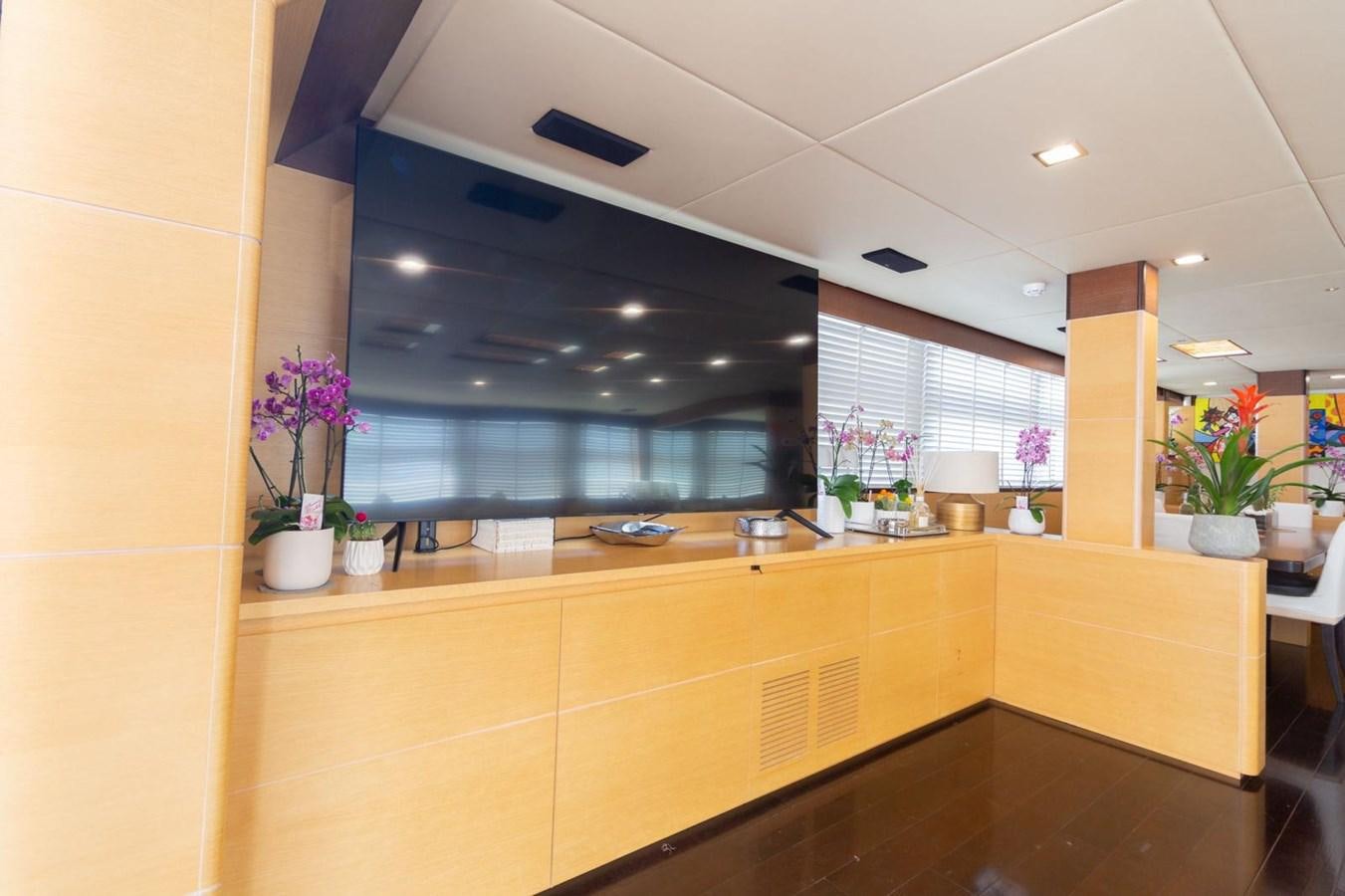 a kitchen with a large window aboard MR GU Yacht for Sale