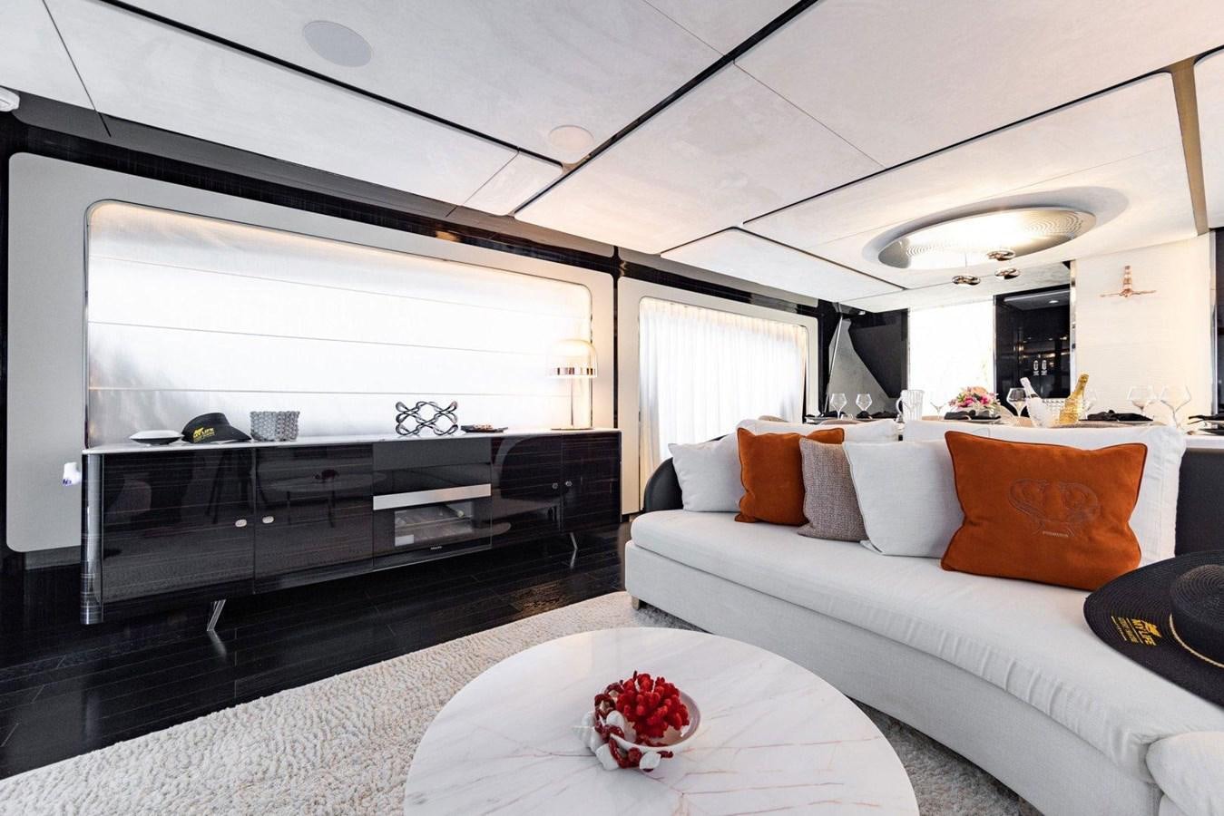 a living room with a large mirror aboard POSILLIPO TECHNEMA 90 Yacht for Sale