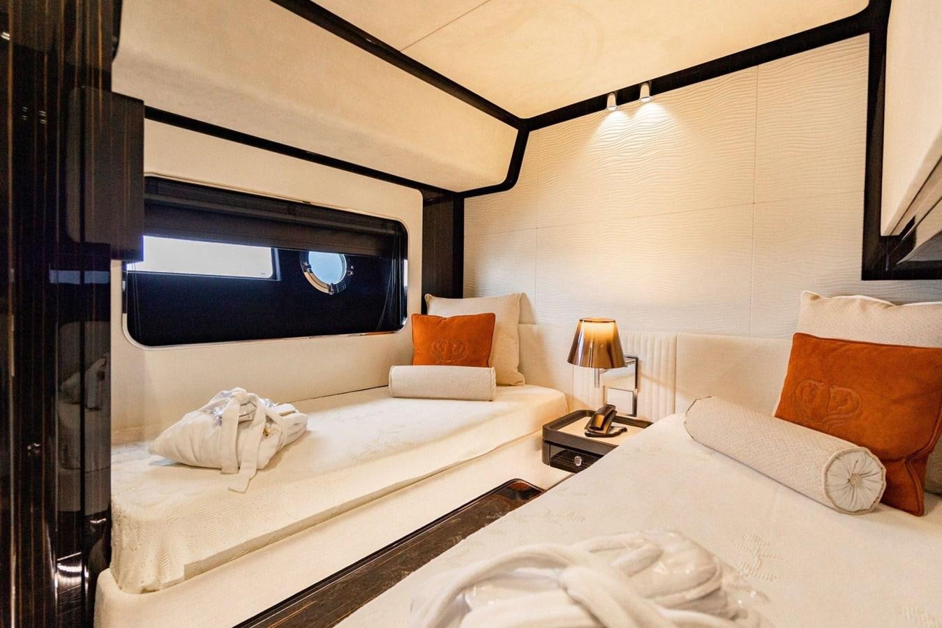 a couple of beds in a hotel room aboard POSILLIPO TECHNEMA 90 Yacht for Sale