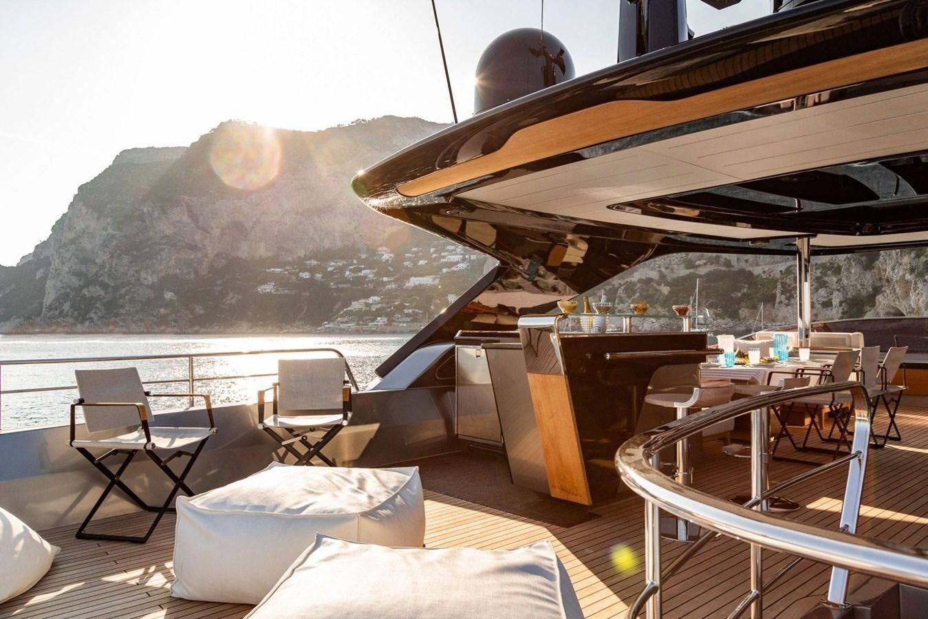 a patio with a table and chairs aboard POSILLIPO TECHNEMA 90 Yacht for Sale