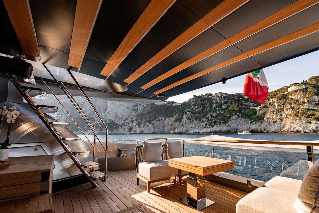 a room with a view of the ocean and a large rock wall aboard POSILLIPO TECHNEMA 90 Yacht for Sale