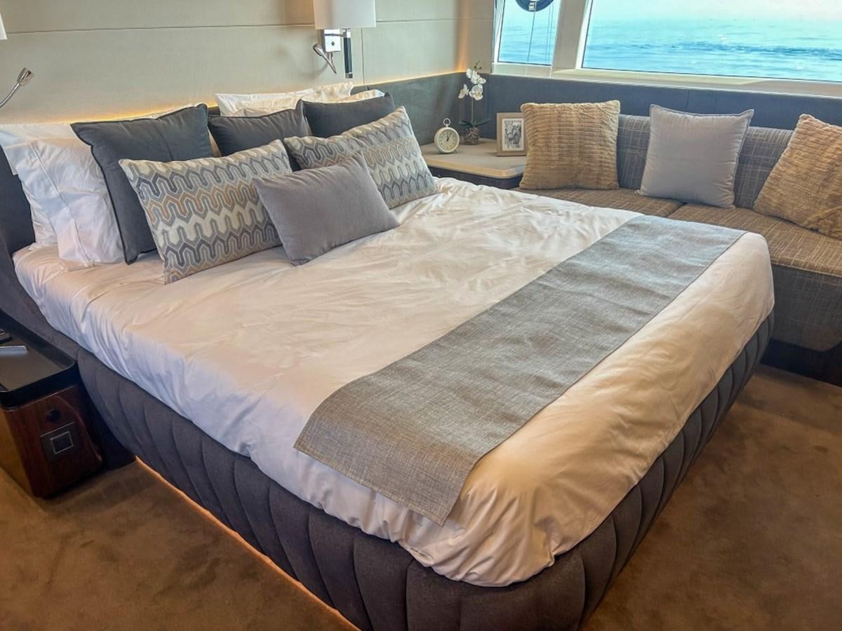 a bed with pillows aboard 2024 NEW SQUADRON 68 FAIRLINE Yacht for Sale