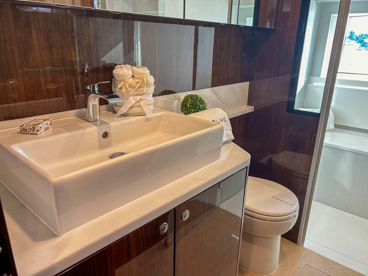 a bathroom with a sink and toilet aboard 2024 NEW SQUADRON 68 FAIRLINE Yacht for Sale