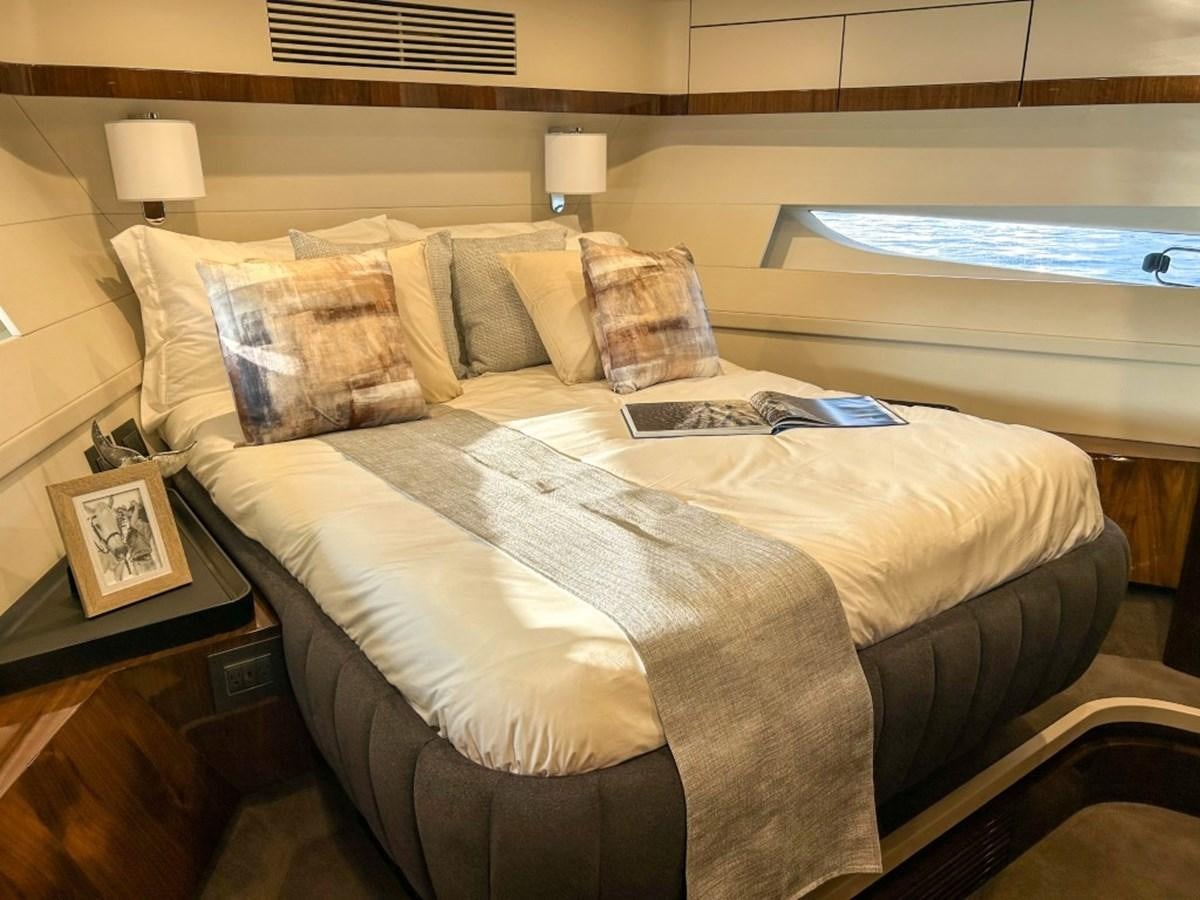 a bed with a pillow on it aboard 2024 NEW SQUADRON 68 FAIRLINE Yacht for Sale