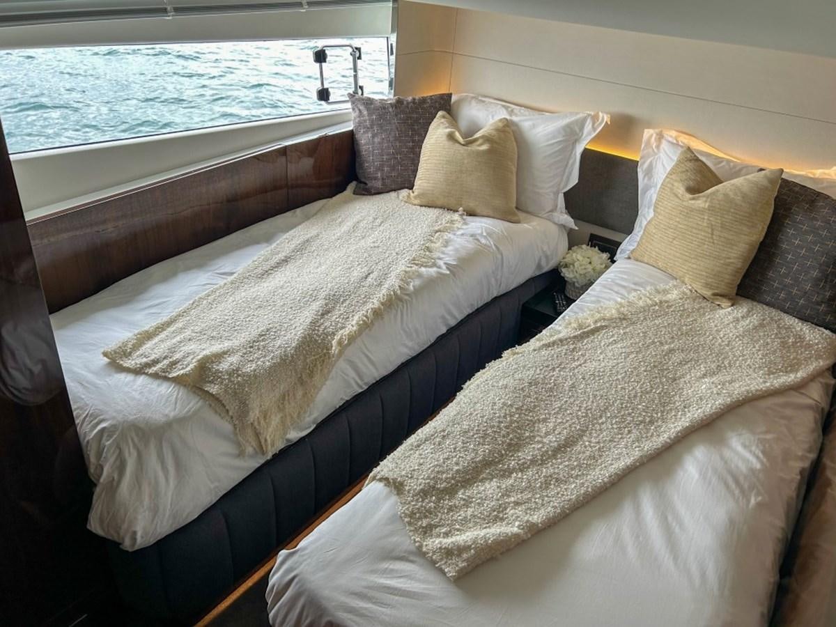 a bed with pillows aboard 2024 NEW SQUADRON 68 FAIRLINE Yacht for Sale