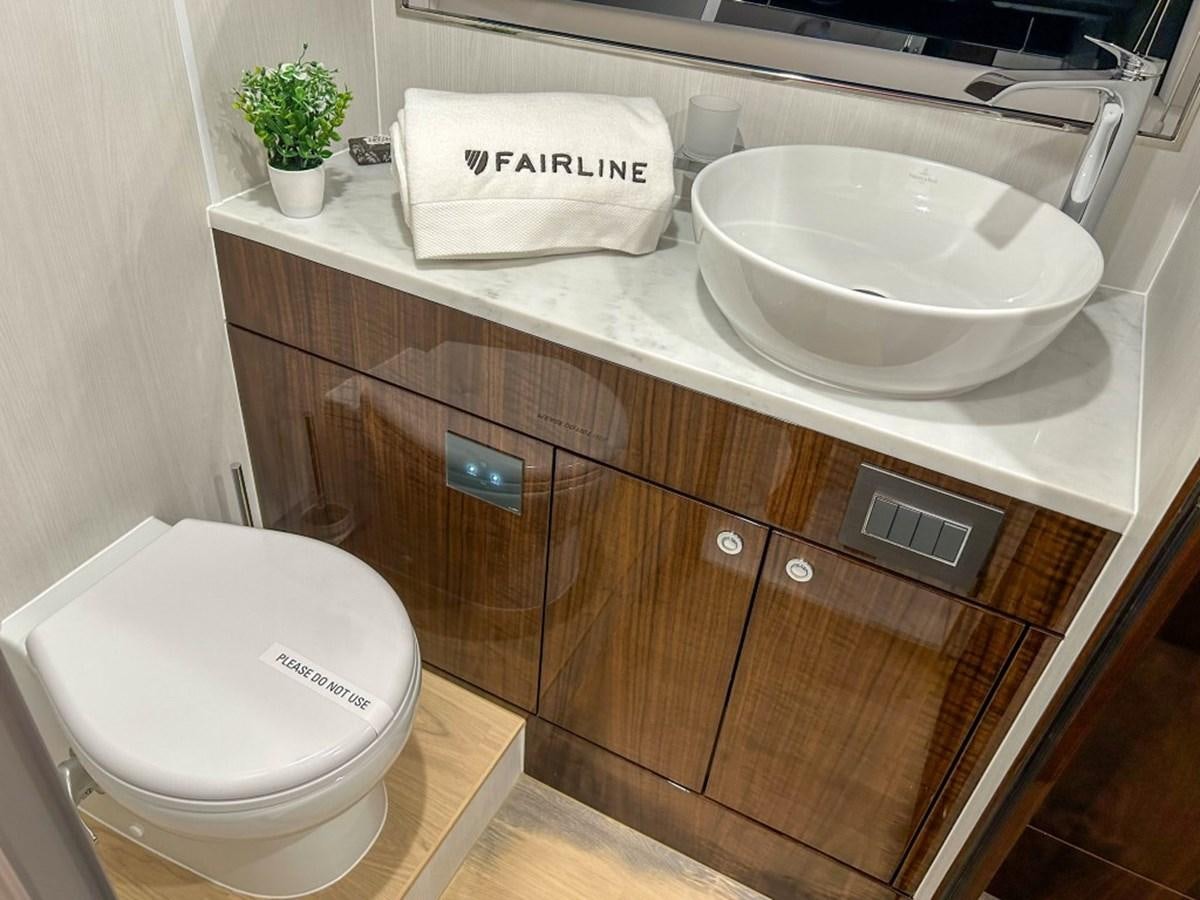 a bathroom sink with a toilet aboard 2024 NEW SQUADRON 68 FAIRLINE Yacht for Sale