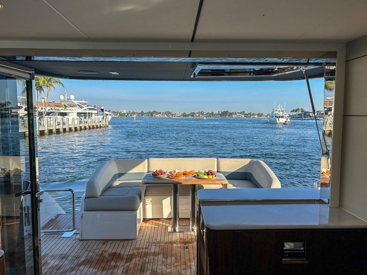 a room with a table and chairs and a view of the water aboard 2024 NEW SQUADRON 68 FAIRLINE Yacht for Sale