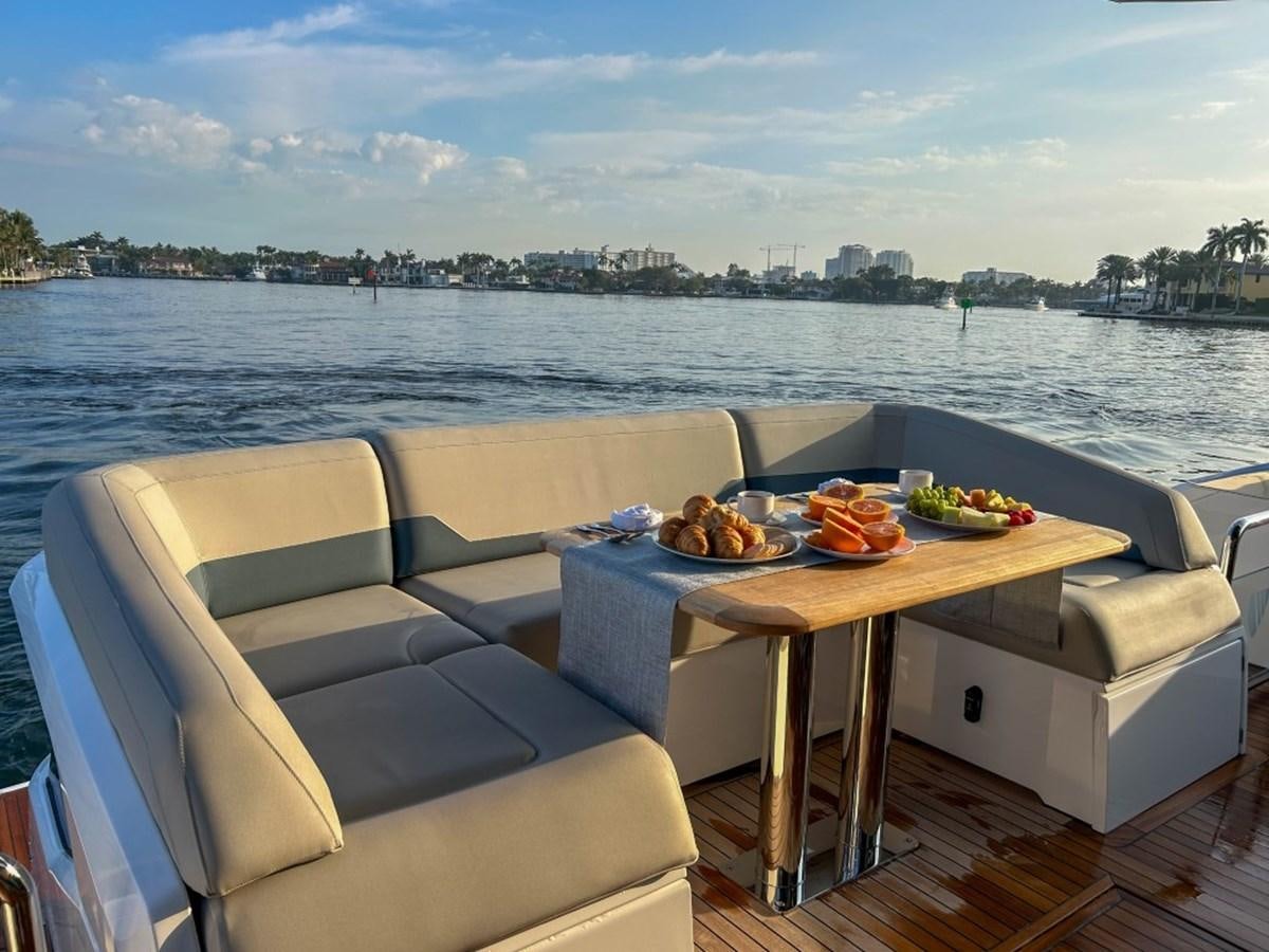 a table with food on it aboard 2024 NEW SQUADRON 68 FAIRLINE Yacht for Sale