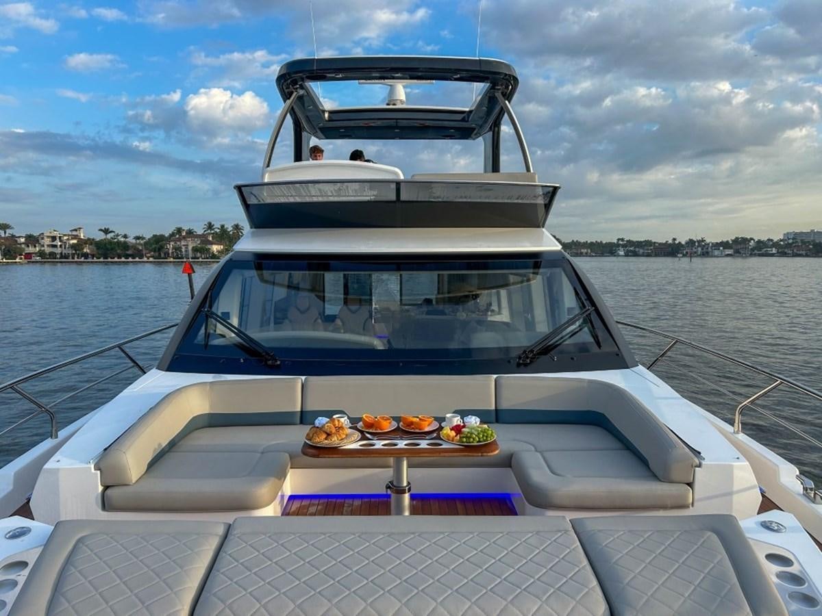 a boat with food on it aboard 2024 NEW SQUADRON 68 FAIRLINE Yacht for Sale