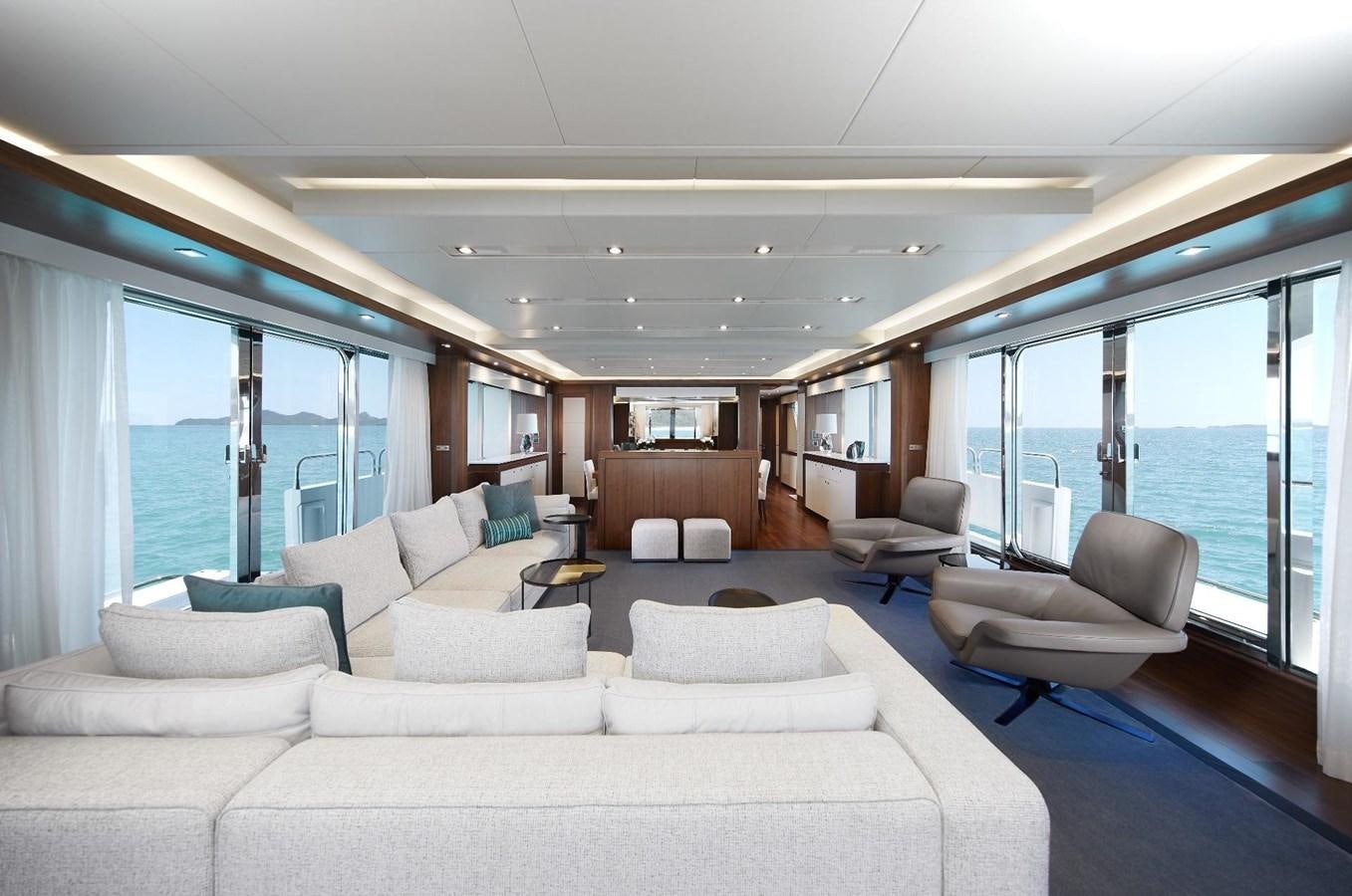 a living room with a large window aboard GEORGE P Yacht for Sale