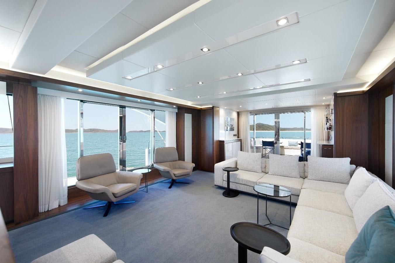a living room with a large window aboard GEORGE P Yacht for Sale