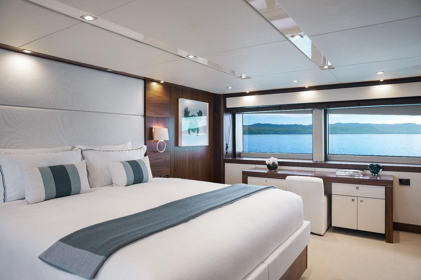 a bedroom with a large bed aboard GEORGE P Yacht for Sale