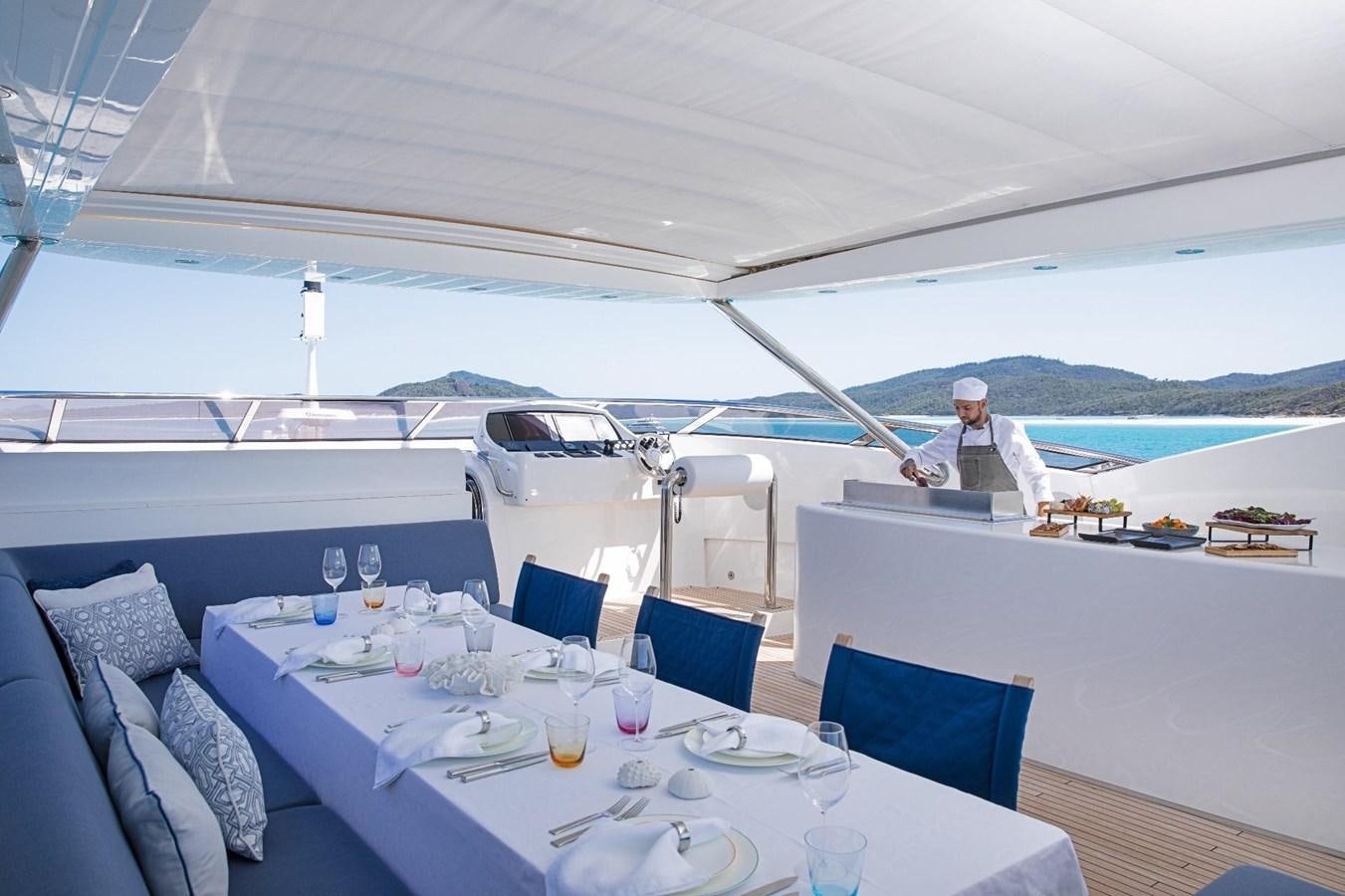 a person standing at a table aboard GEORGE P Yacht for Sale