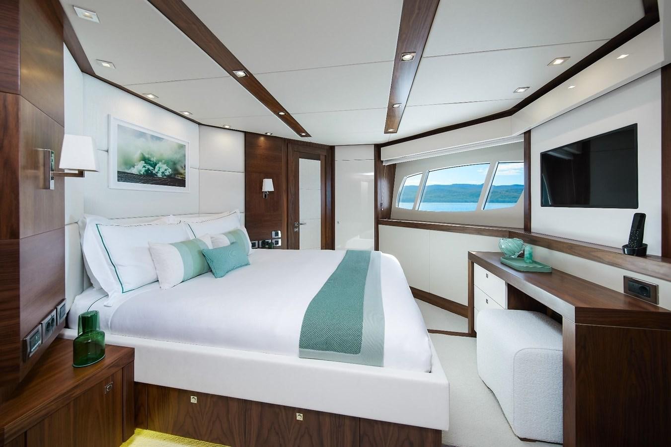 a room with a bed and a desk aboard GEORGE P Yacht for Sale