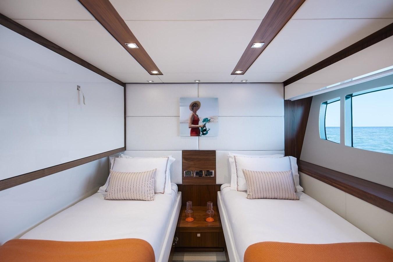 a room with a bed and a mirror aboard GEORGE P Yacht for Sale