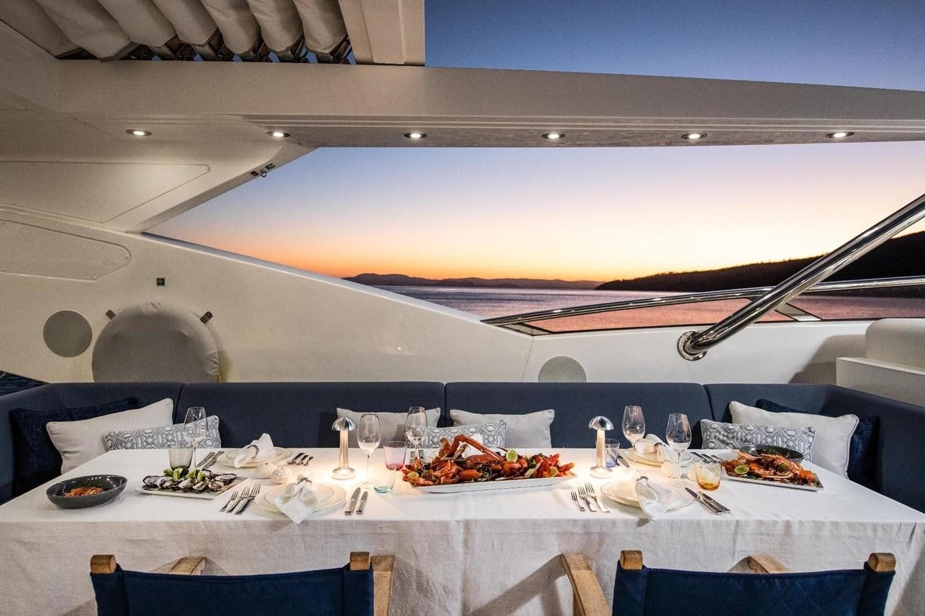 a table set for a dinner party aboard GEORGE P Yacht for Sale