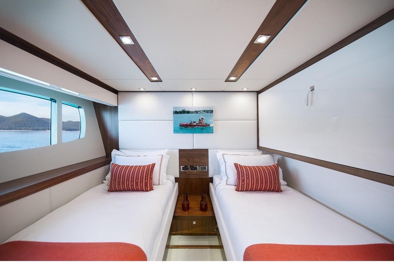 a room with a bed and a fireplace aboard GEORGE P Yacht for Sale