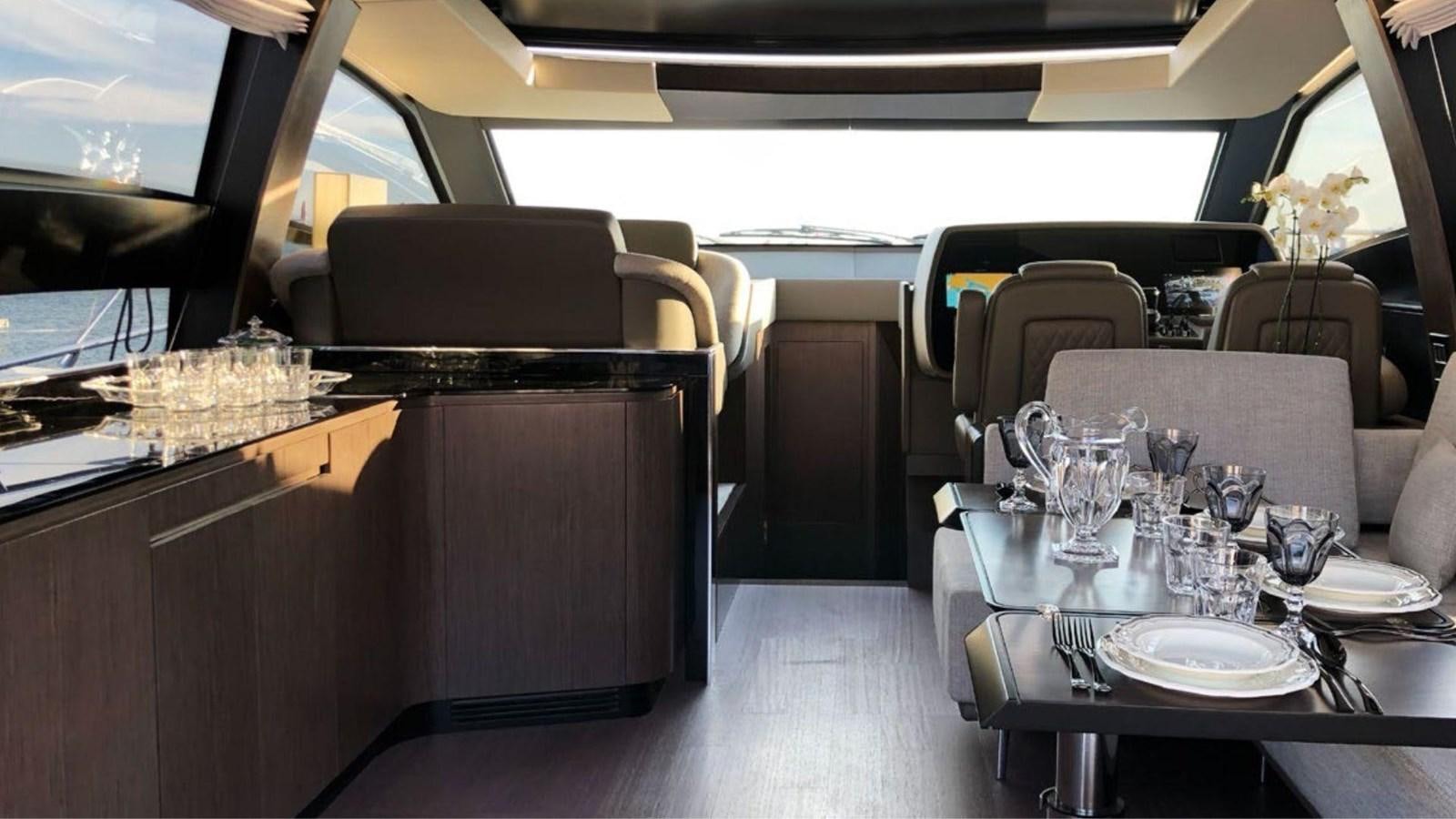 a restaurant with a table and chairs aboard IN SIX Yacht for Sale