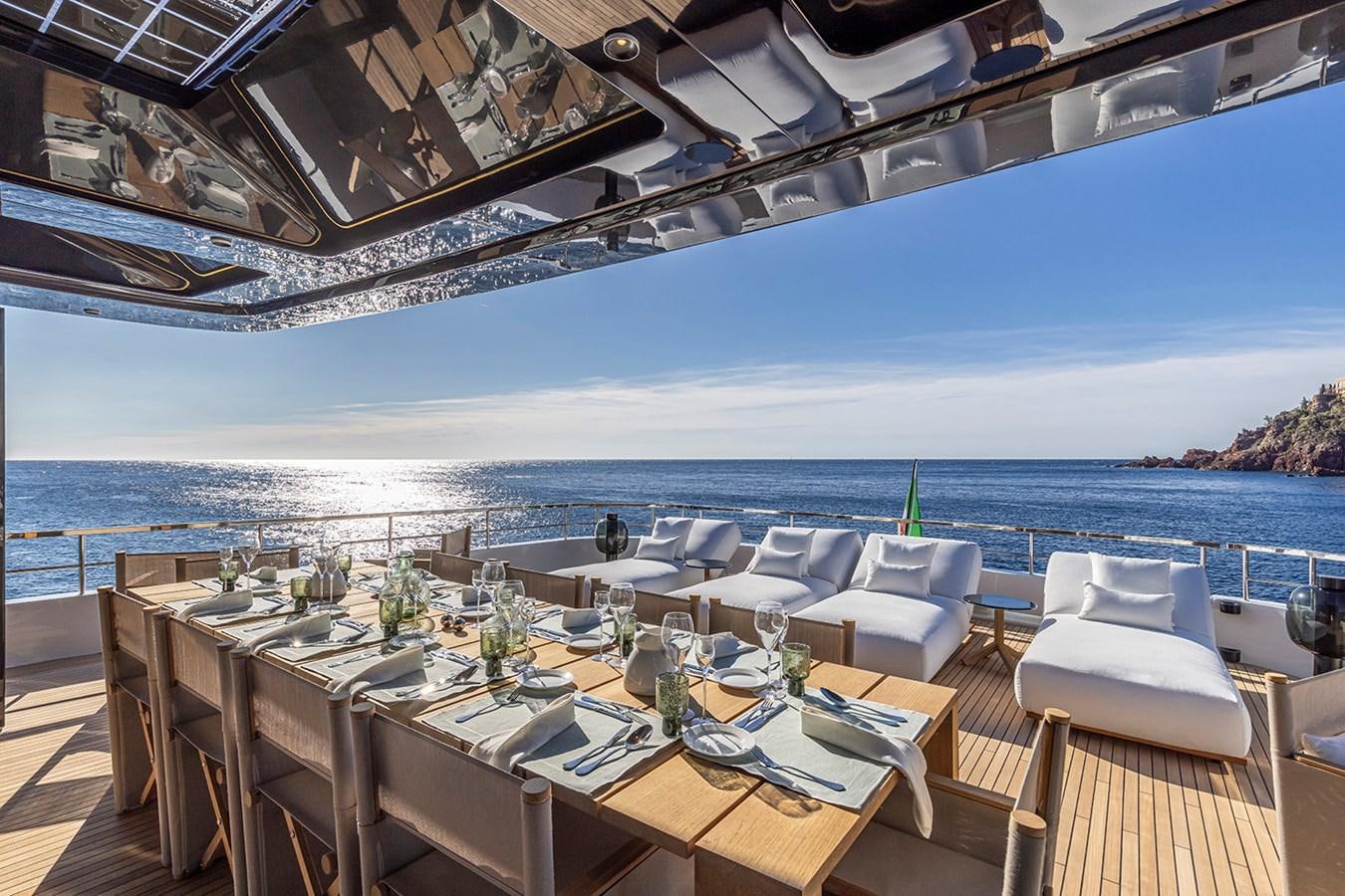 a room with a table and chairs aboard ARCADIA 96 Yacht for Sale