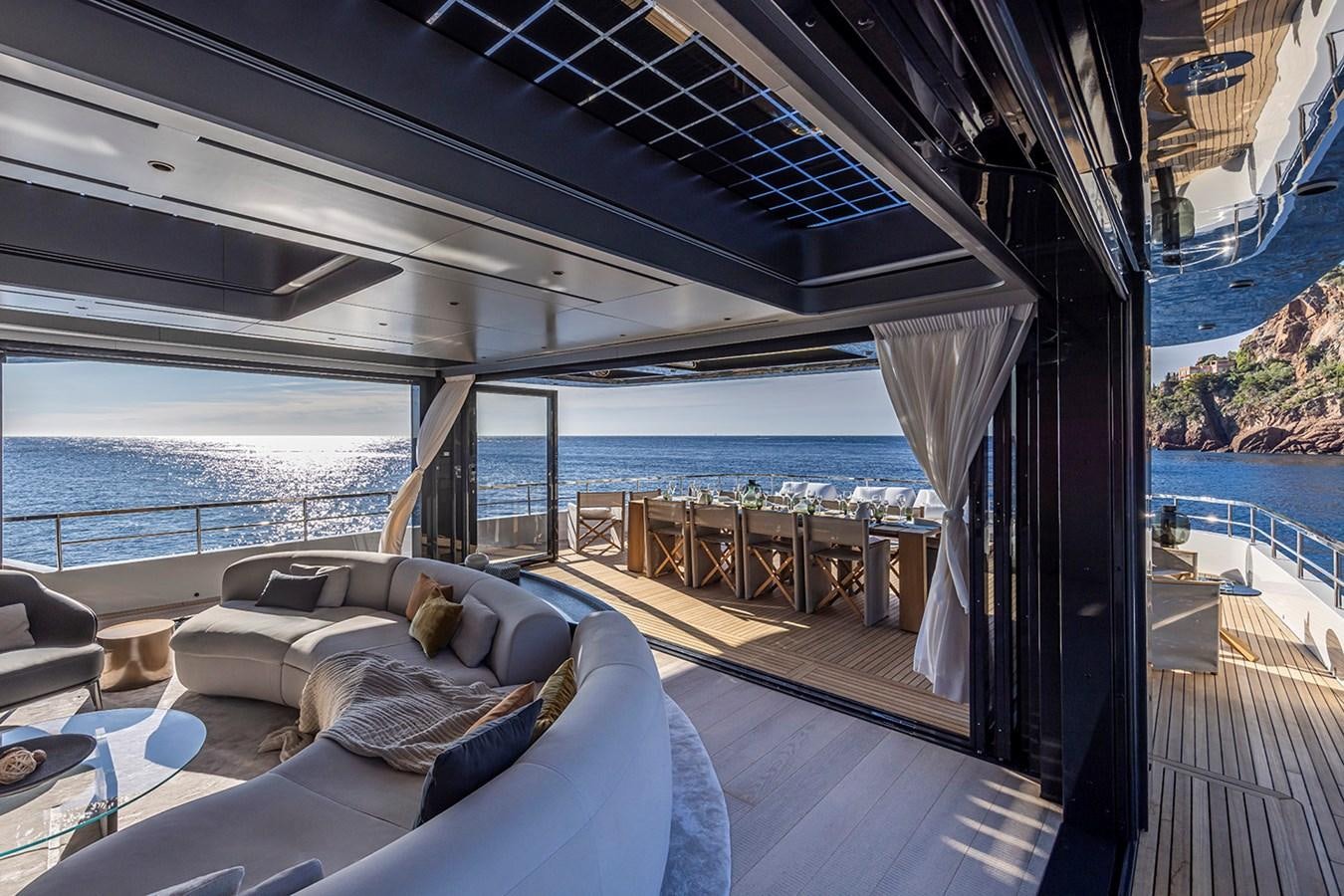 a balcony with a bed and a view of the ocean aboard ARCADIA 96 Yacht for Sale