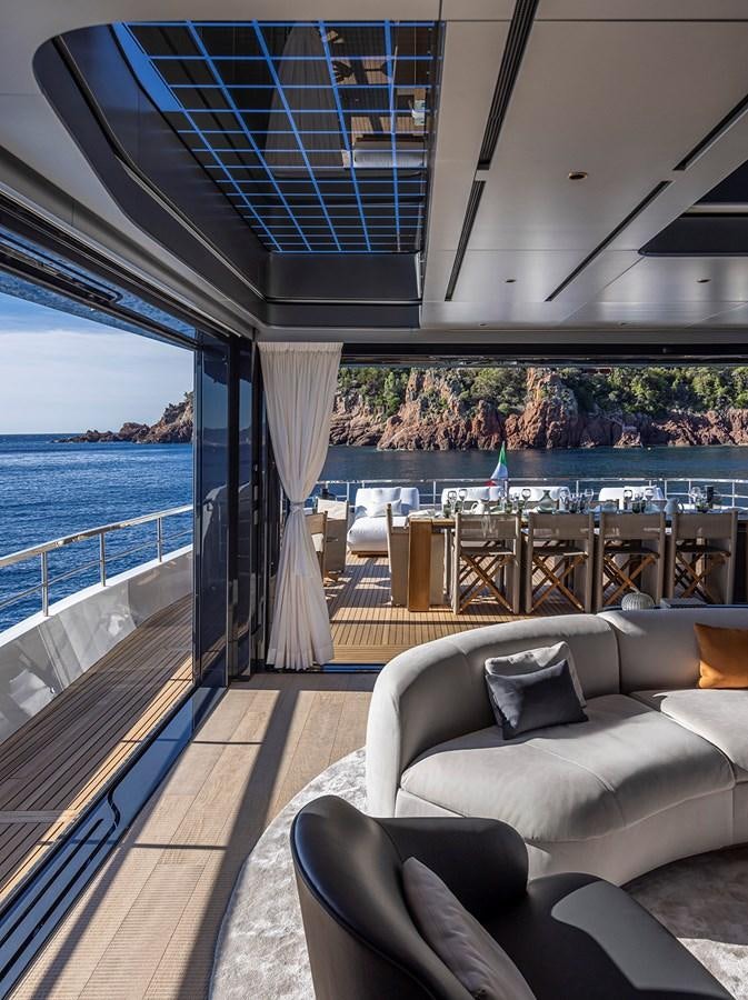 a room with a view of the ocean and a deck aboard ARCADIA 96 Yacht for Sale