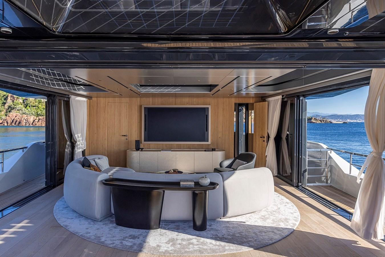 a living room with a large window aboard ARCADIA 96 Yacht for Sale