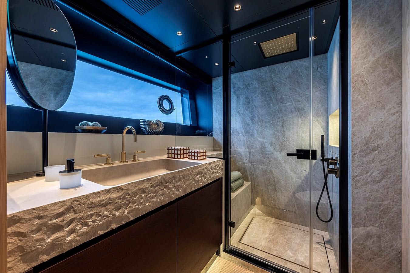 a bathroom with a large glass shower aboard ARCADIA 96 Yacht for Sale