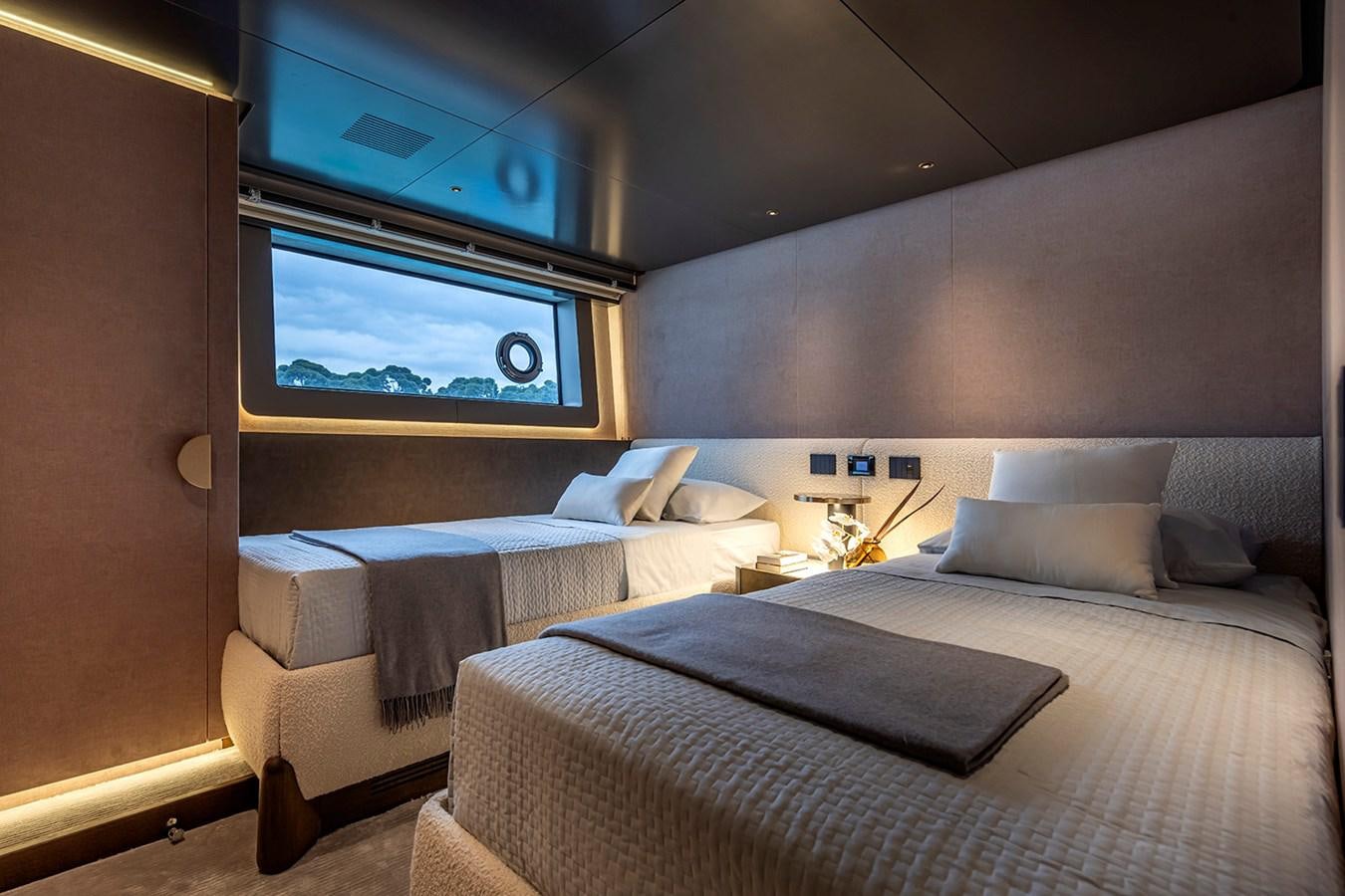 a room with two beds aboard ARCADIA 96 Yacht for Sale