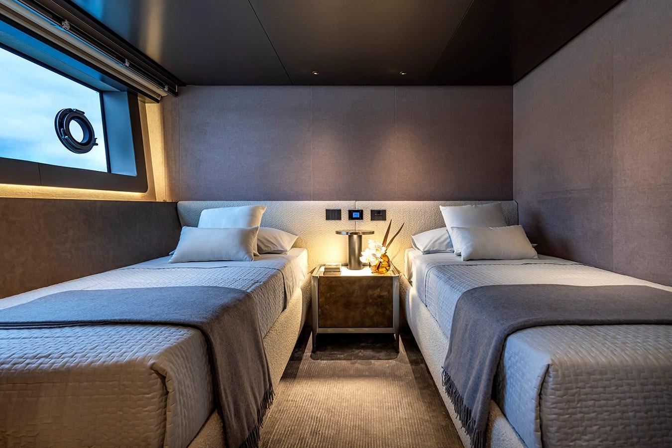 a room with two beds aboard ARCADIA 96 Yacht for Sale