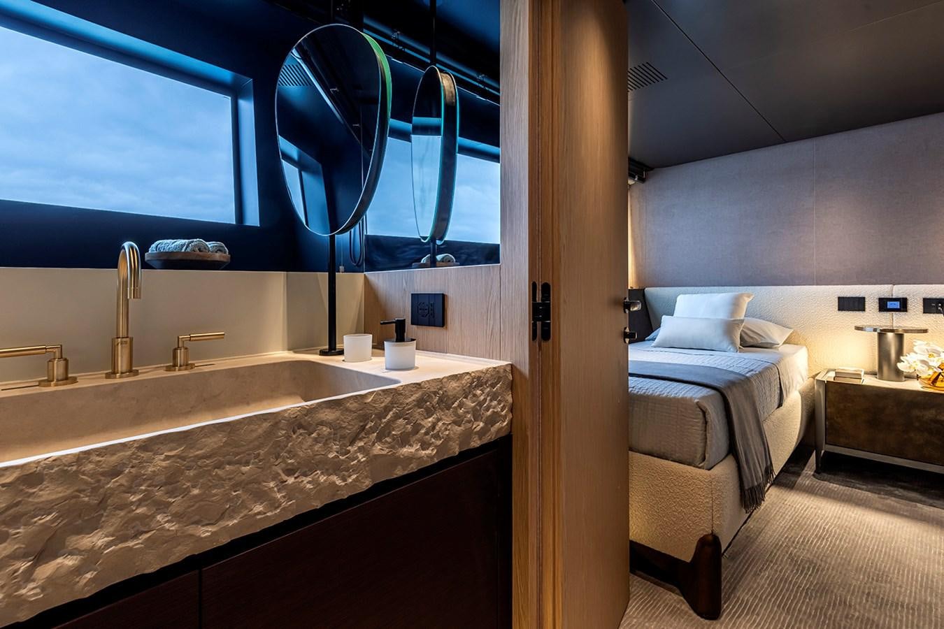 a bathroom with a large mirror aboard ARCADIA 96 Yacht for Sale