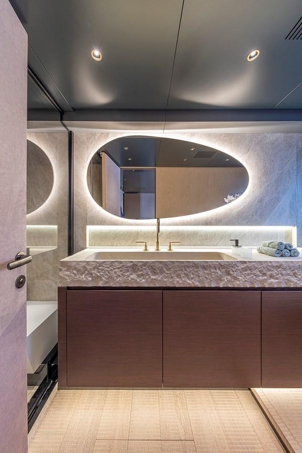a bathroom with a large mirror aboard ARCADIA 96 Yacht for Sale